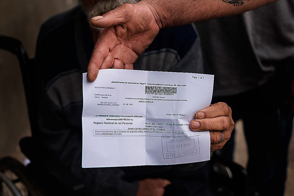 A man holding his friend's ID paper, after that someone steal his belongings.