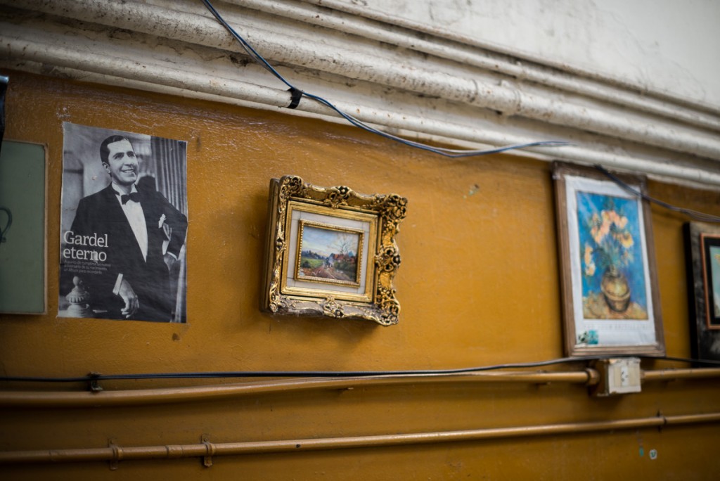 Small gadgets and posters held on the wall.